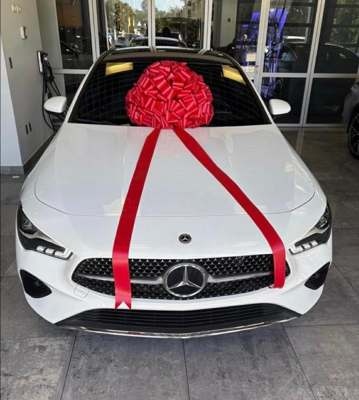 New Mercedes with red bow